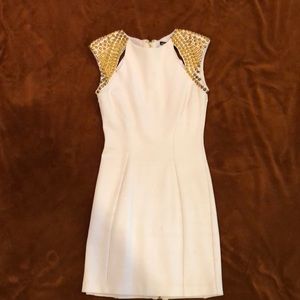 Bebe Addiction white dress with gold detail